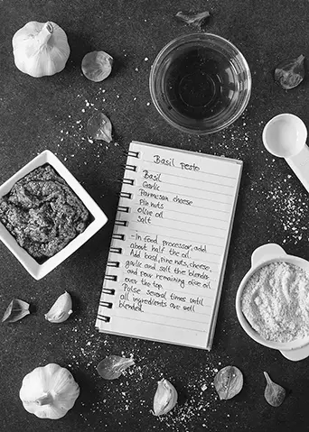 Recipe notebook surrounded by fresh ingredients and spices